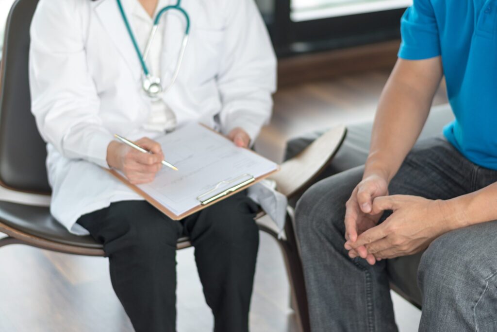 patient discussing genital warts diagnosis