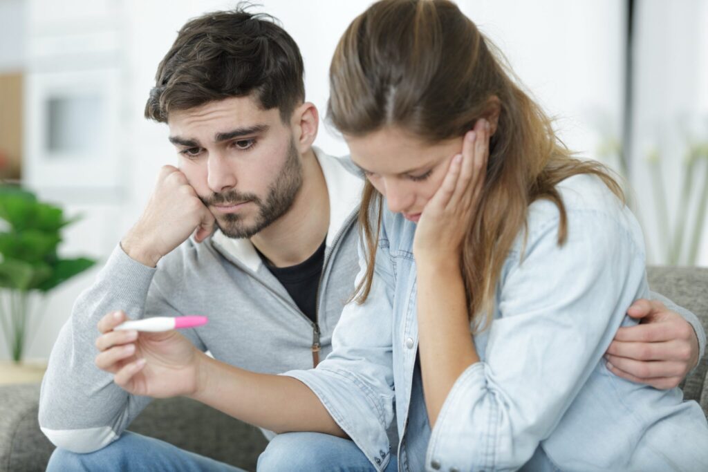STIs That Cause Infertility In Men | Broadgate GP man and woman reacting to negative pregnancy test