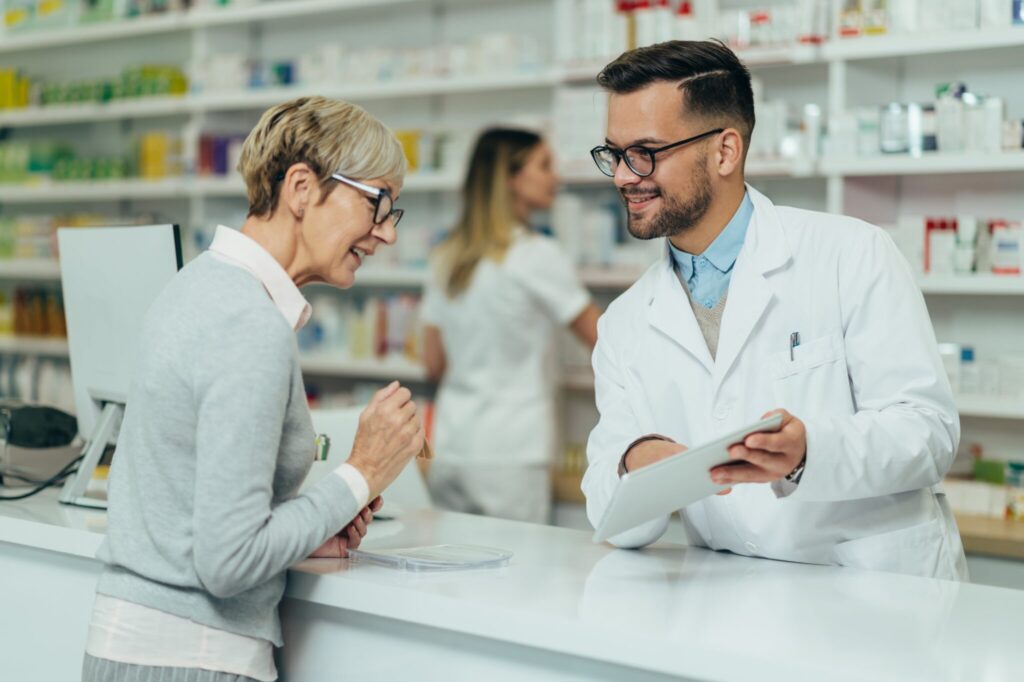 Should I Go To The Pharmacy Or GP? | Broadgate GP pharmacist assisting elderly woman