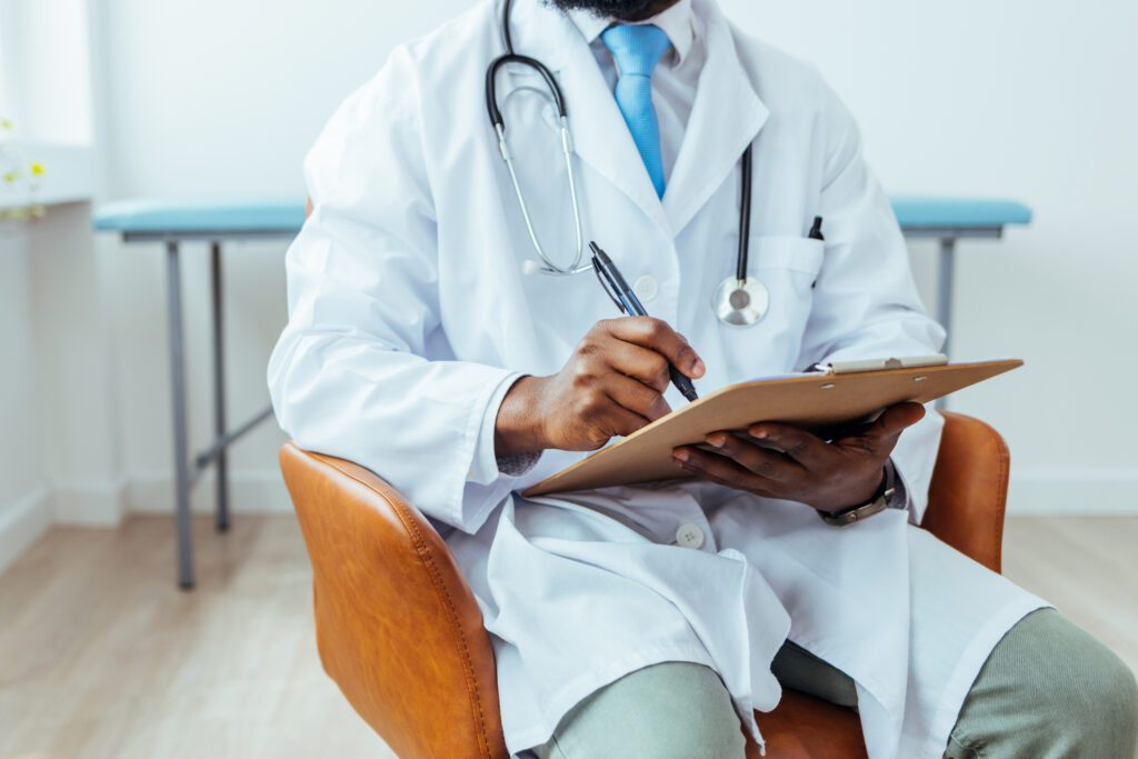 Doctor writing a medical prescription