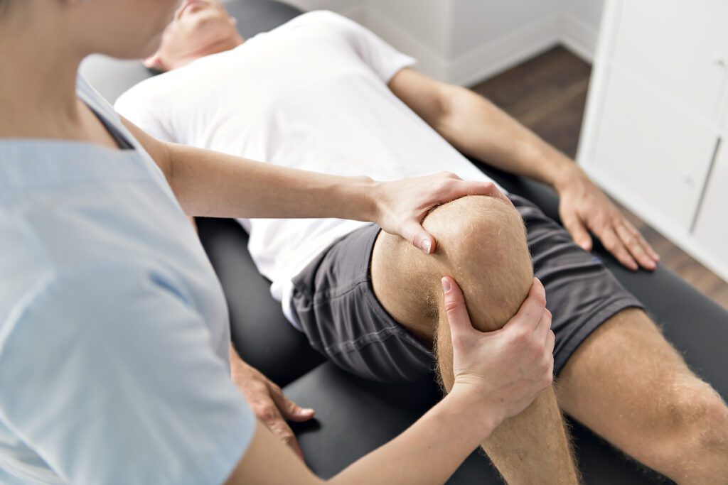 Physical therapists are checking patients elbows at the clinic office room.