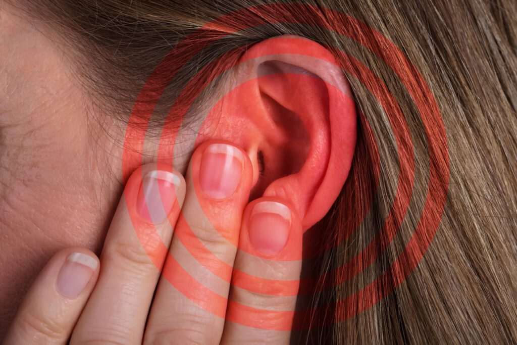 Red Circle Pattern On Woman's Ear