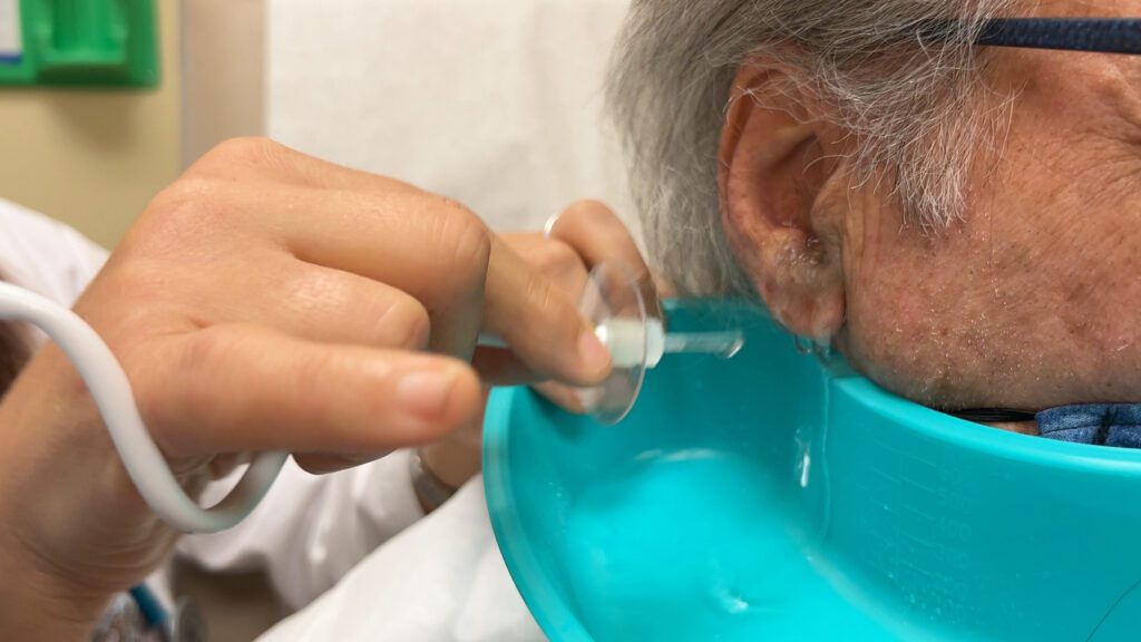 Senior man having ear was removed