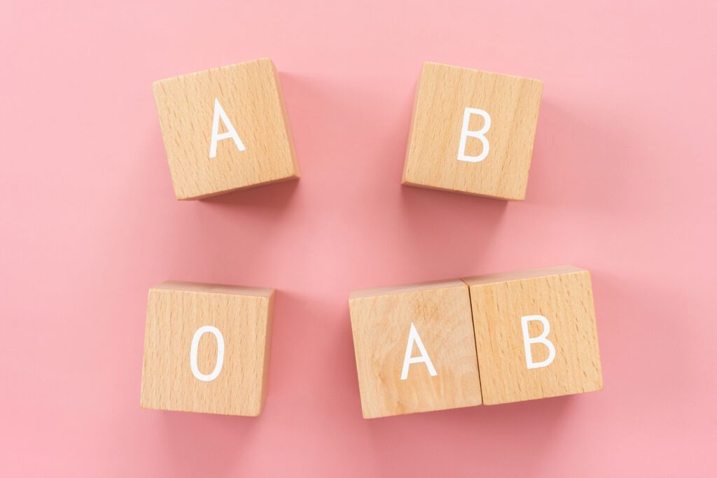 Blood type; Wooden blocks with "A B O AB" text of concept.