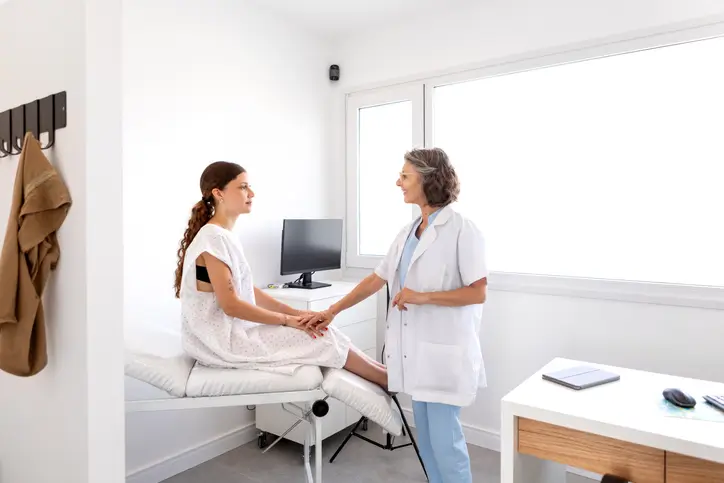 A doctor speaking to a patient about their worries.